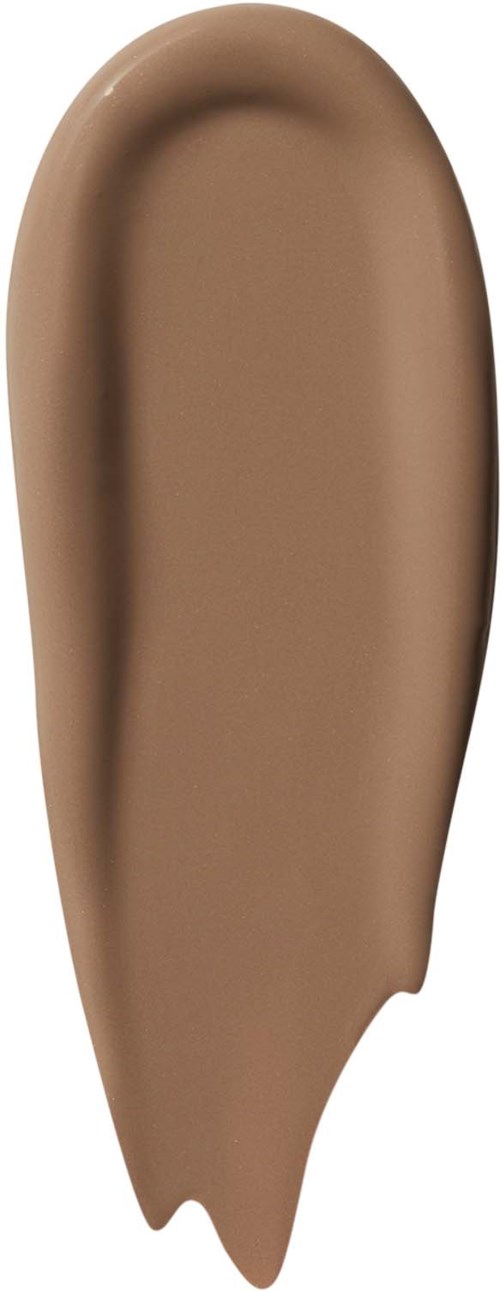 En borste av beigefärgad flytande makeup eller foundation med en slät, något kurvad form.