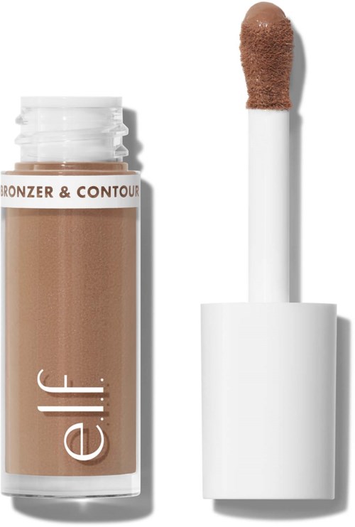 En flaska med beige concealer med en applikator bredvid.