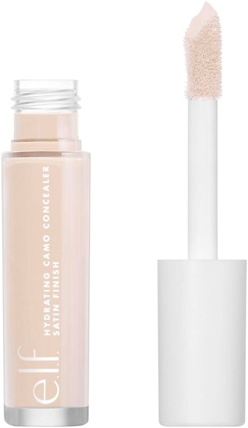 En beige flytande concealare i ett genomskinligt rör med vit kork och applikatorborste.
