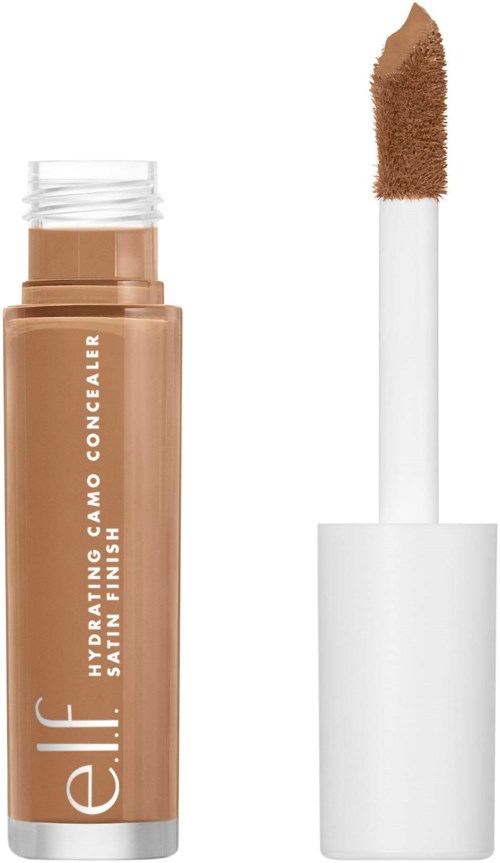 En beige concealer-rør med hvit tekst og hvit kork med påføringspusterør.