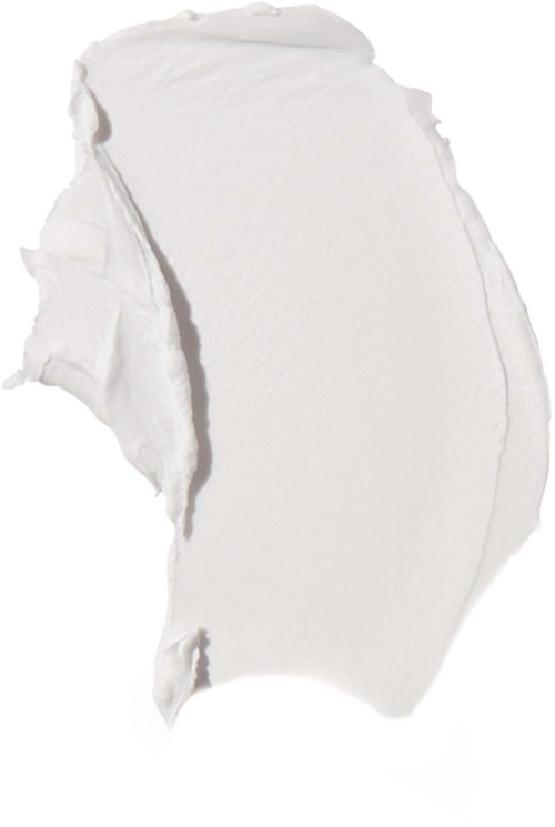 En vit kräm eller lotion spridd med en texturerad, ojämn yta och oregelbundna kanter.