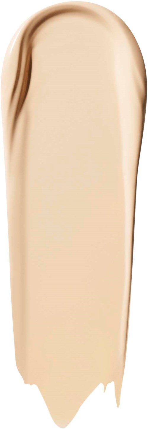 En strimma av beige flytande foundation på svart bakgrund.