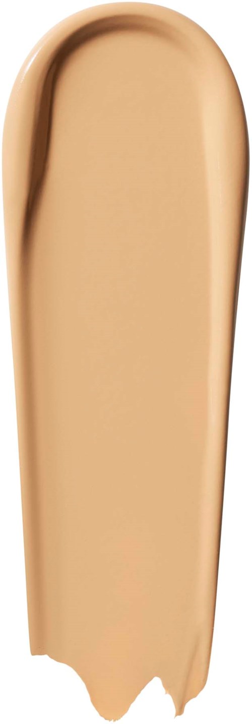 Ett beige sminkbasfärgprov med en slät, krämig konsistens och en lätt glans.