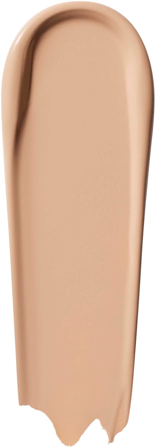 En beige flytende foundation med en glatt, rund overflate og en liten fordypning på toppen, viser et makeup-produkt.