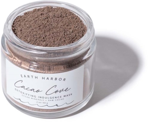 En burk med brun Cacao Clay detox ansiktsmask med vit etikett, visar märket Earth Harbor.