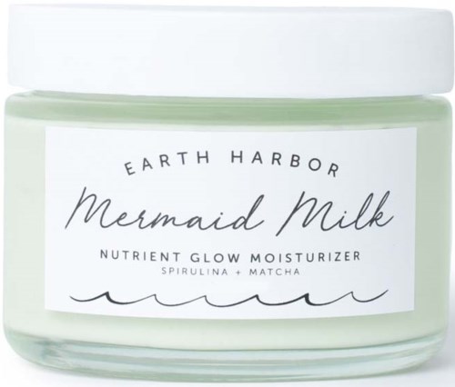 En burk med Earth Harbor Mermaid Milk fuktighetskräm med matcha och spirulina, märkt som näringsglöd fuktighetskräm.