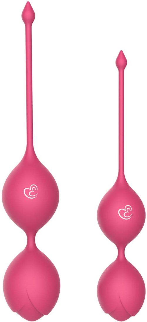 Two pink vaginal tablets with long, narrow tips and rounded, bulbous ends, each with a small logo.