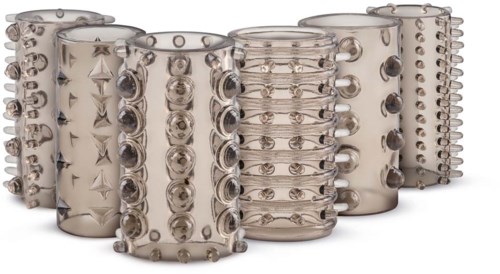 A collection of clear, textured cylindrical bracelets with various raised patterns and studs.