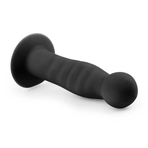 A black, curved object with rounded ends, resembling a dumbbell or weight. It has a wide base and narrows in the middle.