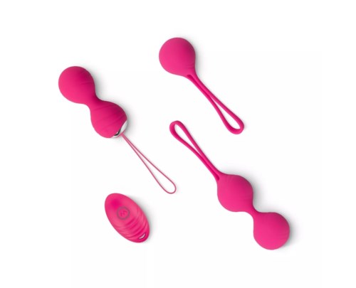 Pink kegel exercise balls with a small remote control, designed for pelvic floor strengthening.