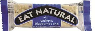 A snack bar named 'Eat Natural' with cashews, blueberries, and coconut on the wrapper.