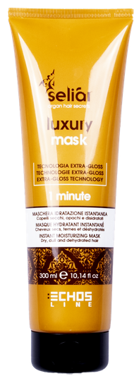 En gul tube med hårkur kalt 'selia luxury mask' med beskrivelser om teknologi og fuktighetsgivende fordeler.