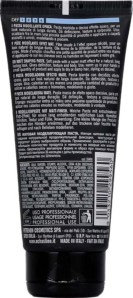 En svart tub med etiketter på flera språk, innehållande en makeup- eller kosmetikprodukt, troligen en primer eller bas.