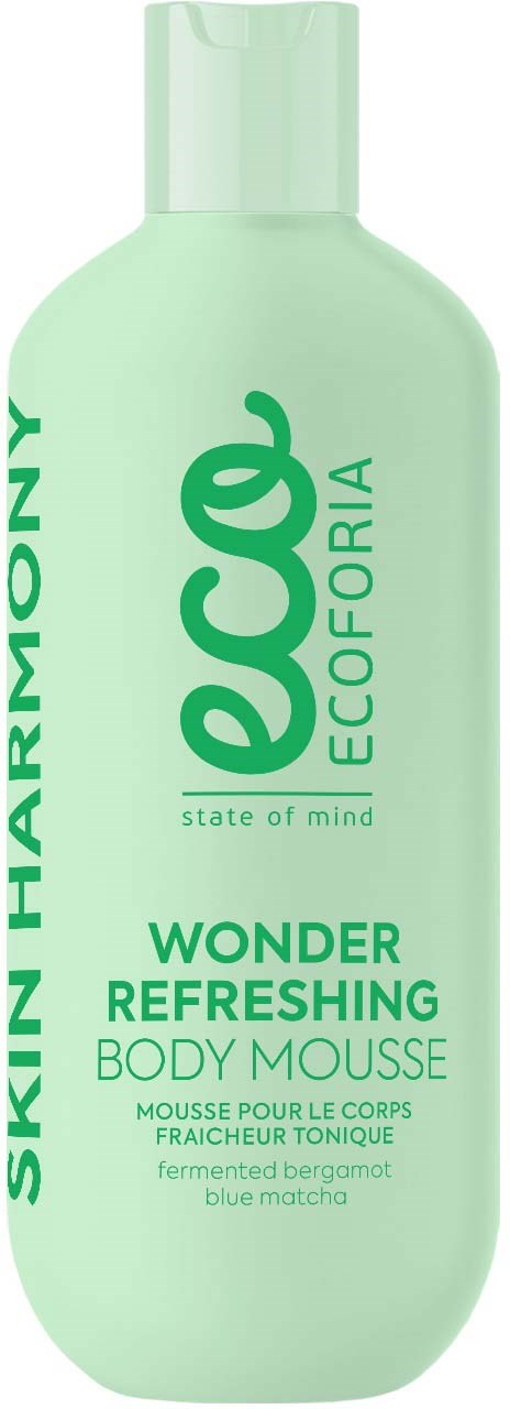En lys grønn flaske med kroppsmousse merket 'Wonder Refreshing' med ingredienser som bergamot og blå matcha. Hudharmoni.