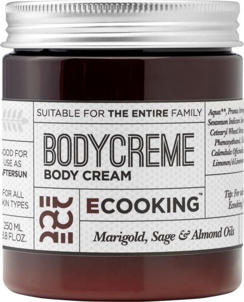 En mörkbrun burk med kroppskräm märkt för hela familjen, med ingredienser som ringblomma, salvia och mandeloljor.