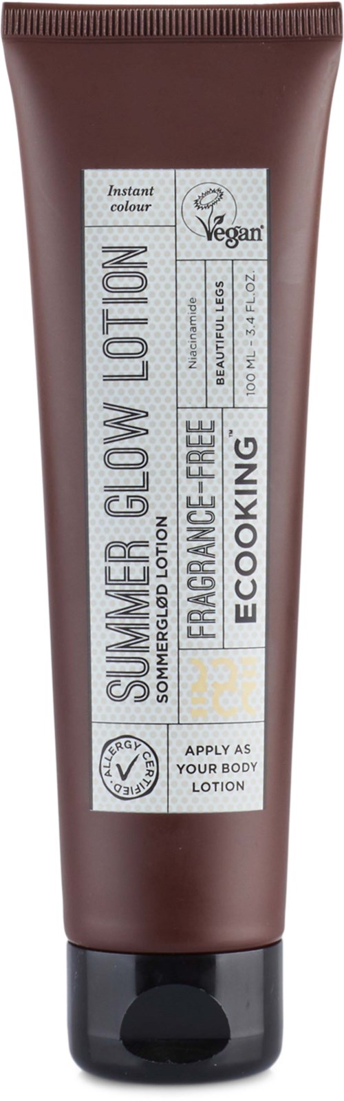 Brown tube labeled Summer Glow Lotion, vegan, fragrance-free, eco-friendly, apply to skin for a glow.