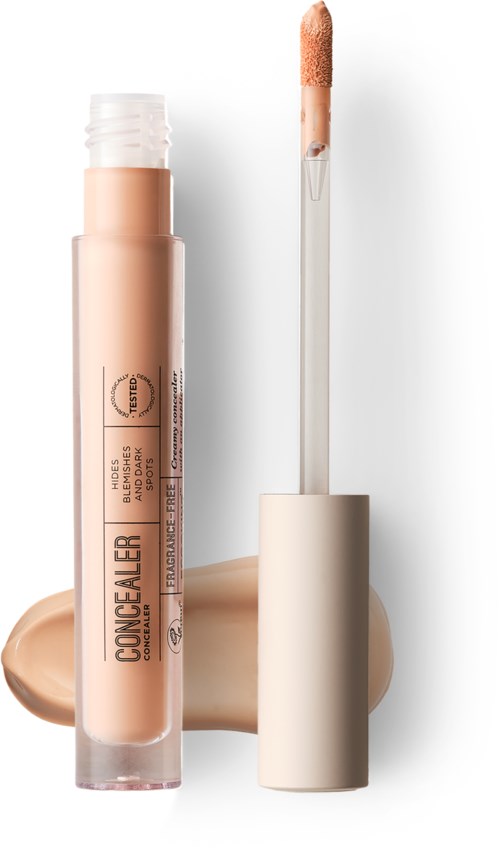 Concealer-rør med applikator, beige væske, og en prøve af produktet.
