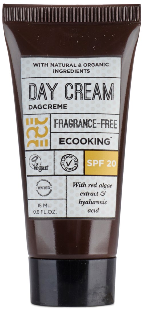 A brown tube of day cream with SPF 20, natural ingredients, vegan label, and water and oil symbols.