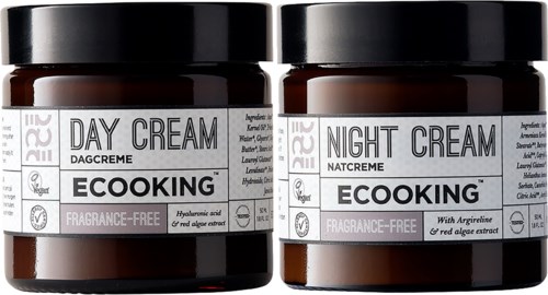 Två bruna burkar med hudvårdskräm, märkta för dag och natt, utan parfym, med spirulinaextrakt.
