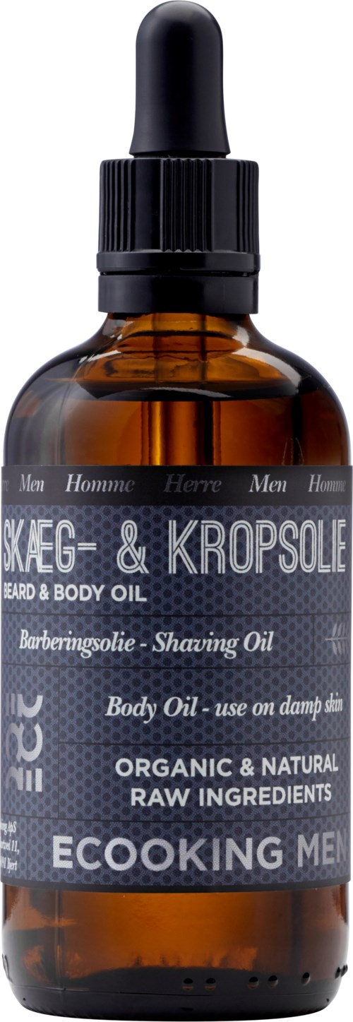 En brun glassflaske med sort dråphette lapp merket for skjegg- og kroppsolje, laget av naturlige ingredienser.