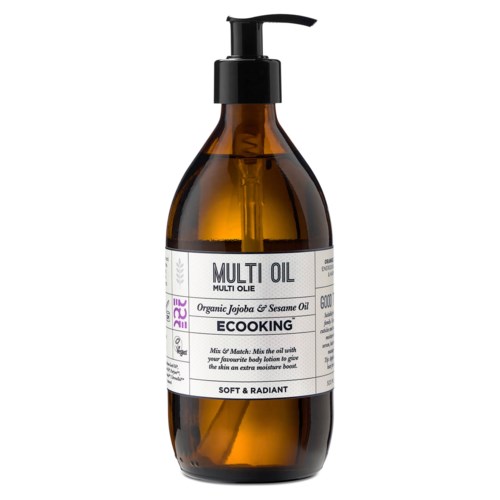 A brown bottle with a black pump labeled 'Multi Oil' containing organic jojoba and sesame oil.