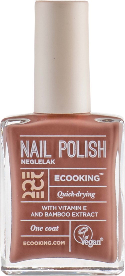 A nail polish bottle in brown color with white cap, describing eco-friendly, quick-drying, and vegan qualities.