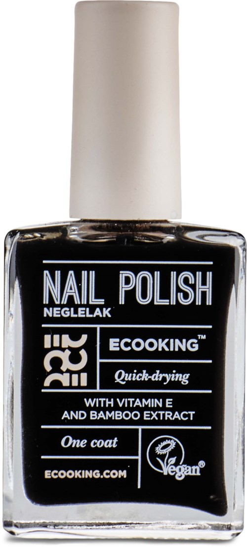 A bottle of black nail polish with a white cap. Brand name and details are on the label. Vegan and quick-drying.