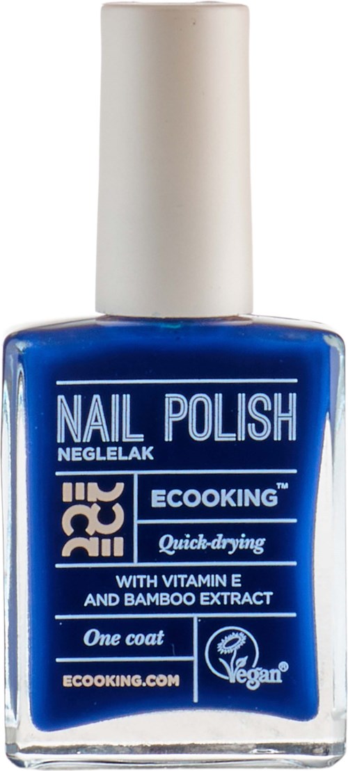 Blue nail polish bottle with white cap, labeled with brand and product details, including quick-drying and vegan symbols.