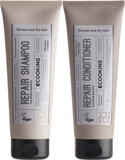 Två beige tuber, en märkt 'Repair Shampoo' och den andra 'Repair Conditioner', för normalt och torrt hår.