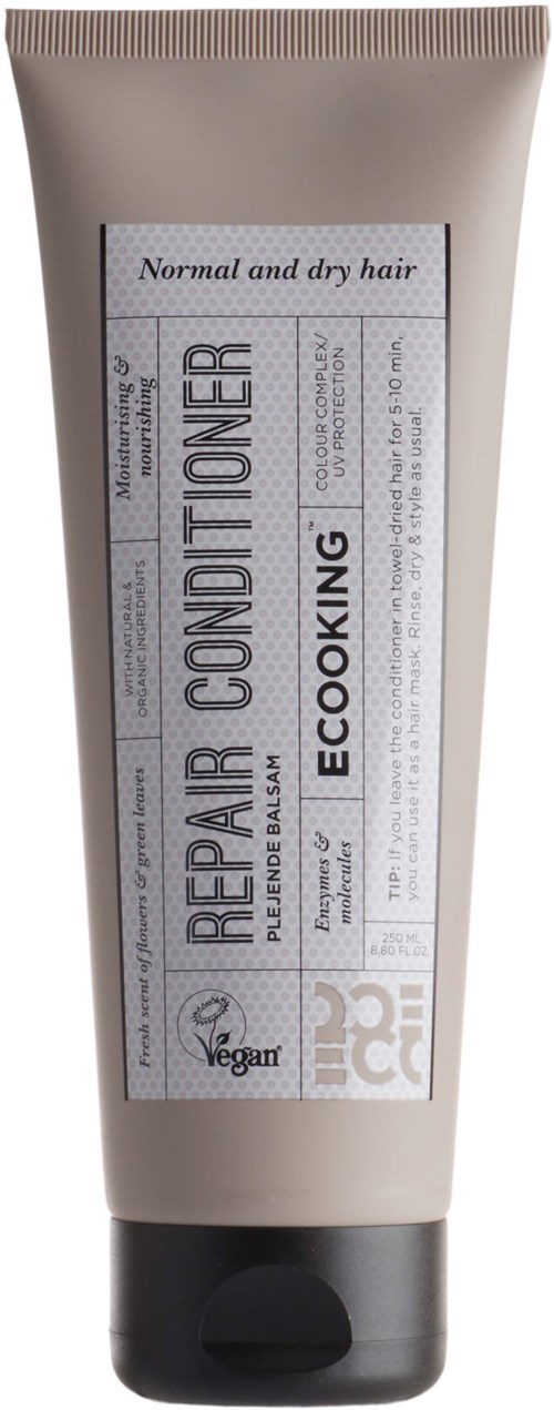 En beige tube med sort låg, mærket til normalt og tørt hår, 'Repair Conditioner' af Ecooking, har veganske og miljøvenlige ikoner.
