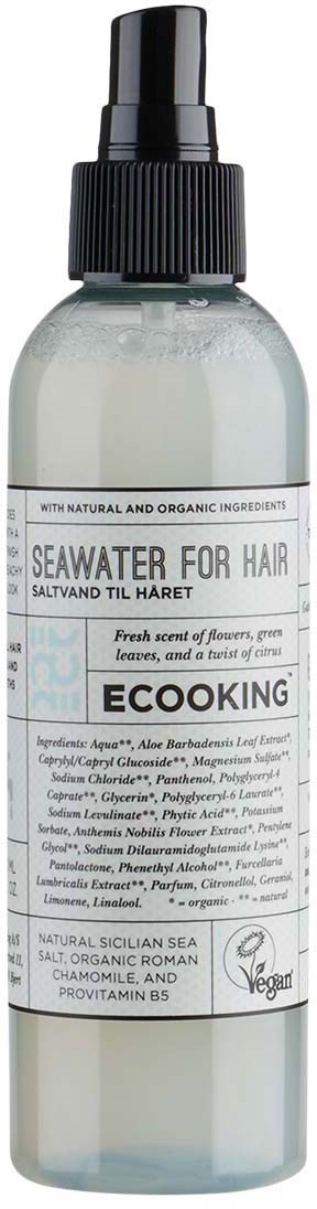 En sprayflaske merket 'Seaweed for Hair' med naturlige ingredienser og vegansertifisering.