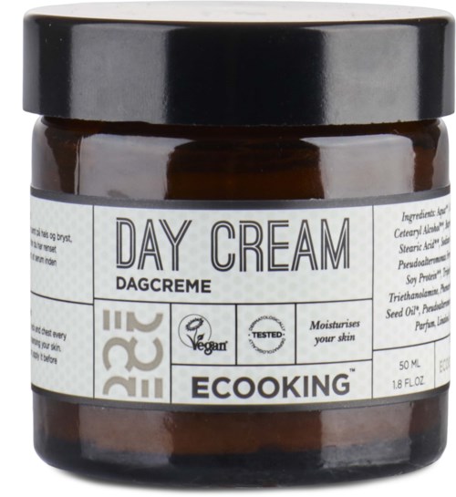 Et glas med vegansk dagcreme mærket Ecooking, med sort låg og hvid etiket med produktdetaljer.