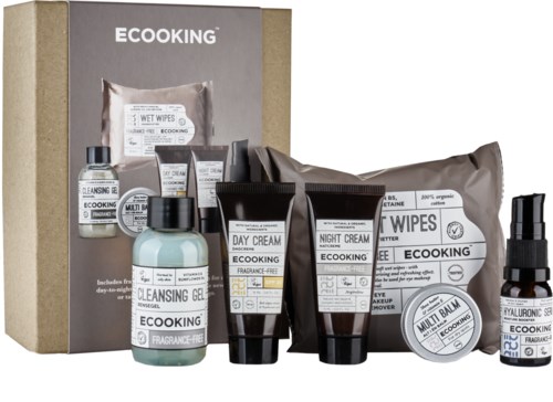 Ett set med miljövänliga hudvårdsprodukter, inklusive krämer, gelé, våtservetter och en spray i svart, vitt och ljusblått förpackning.
