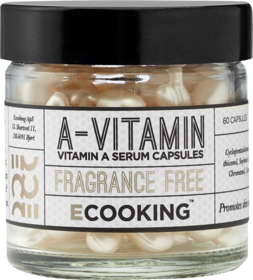 Ett glas fyllt med vita kapslar märkt som Vitamin A-serumkapslar, parfymfria, tillverkade av E Cooking, innehåller 60 kapslar.