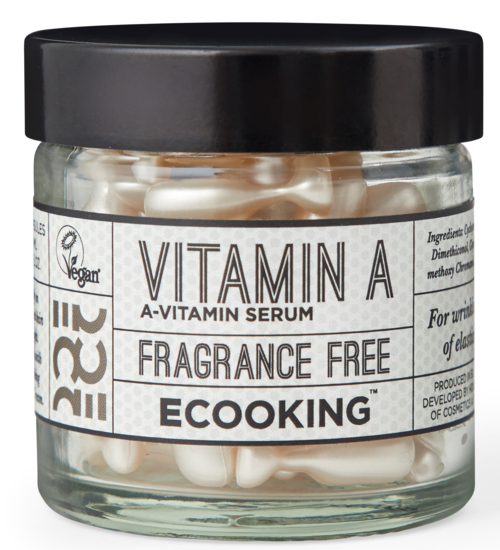 VITAMIN A-serum i en klar burk med svart lock, innehåller kapslar, doftfri, miljövänlig produkt. Etiketten har information och logotyper.