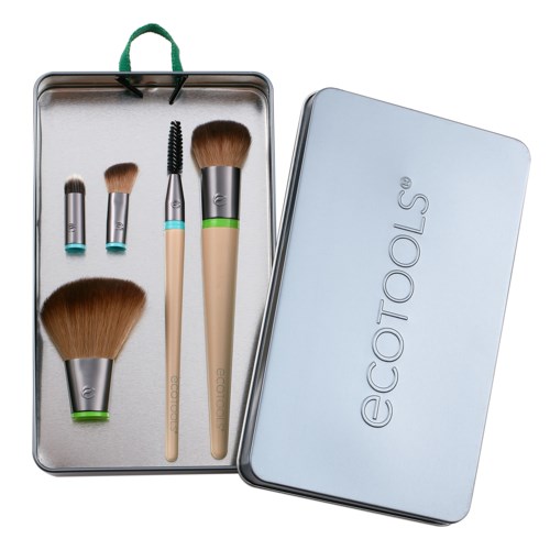 Makeup brushes and tools in a metal case, with an EcoTools tin box placed beside it.