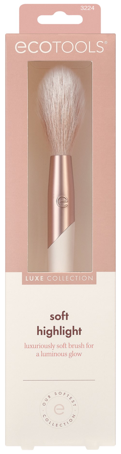A makeup brush with soft bristles and a rose gold handle in a pink and white box. It is from EcoTools."