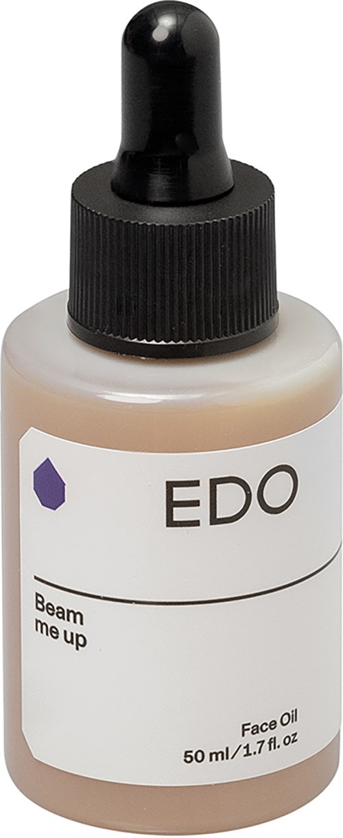 Kleine fles met druppelcap gemarkeerd ED O en 'Face Oil' voor huidverzorging. Het bevat 50 ml.