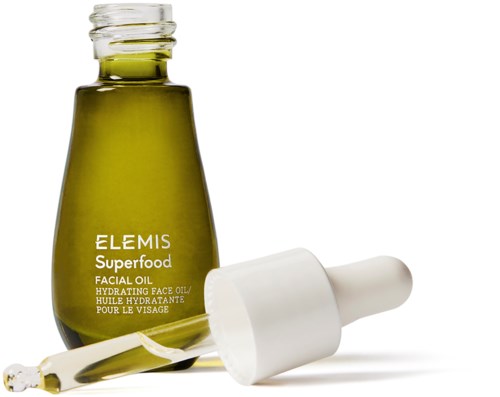 Grön flaska för ansiktsolja med pipett och vit topp, märkt Elemis Superfood Hydrating Face Oil.