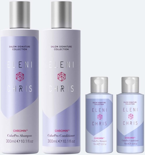 Two large shampoo and conditioner bottles, and two smaller travel bottles, all with purple and silver labels.
