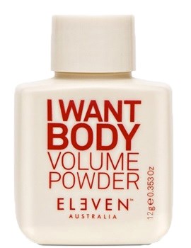 Eine kleine weiße Flasche mit roten und orangefarbenen Text. Es steht I WANT BODY VOLUME POWDER und ELVEN AUSTRALIA.