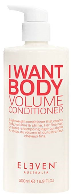 En hvid flaske med pumpe mærket "I WANT BODY VOLUME CONDITIONER". Den indeholder hårbalsam til volumen og glans.