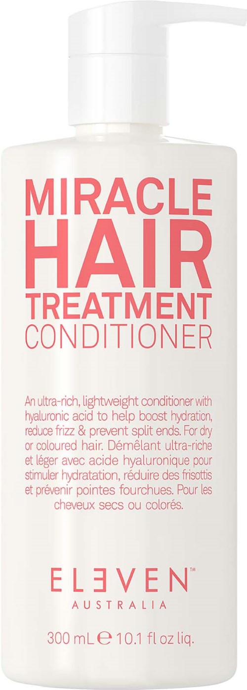 Valkoinen pullo, jossa lukee "Miracle Hair Treatment Conditioner" punaisella tekstillä ELEVEN Australia -merkkiseltä.
