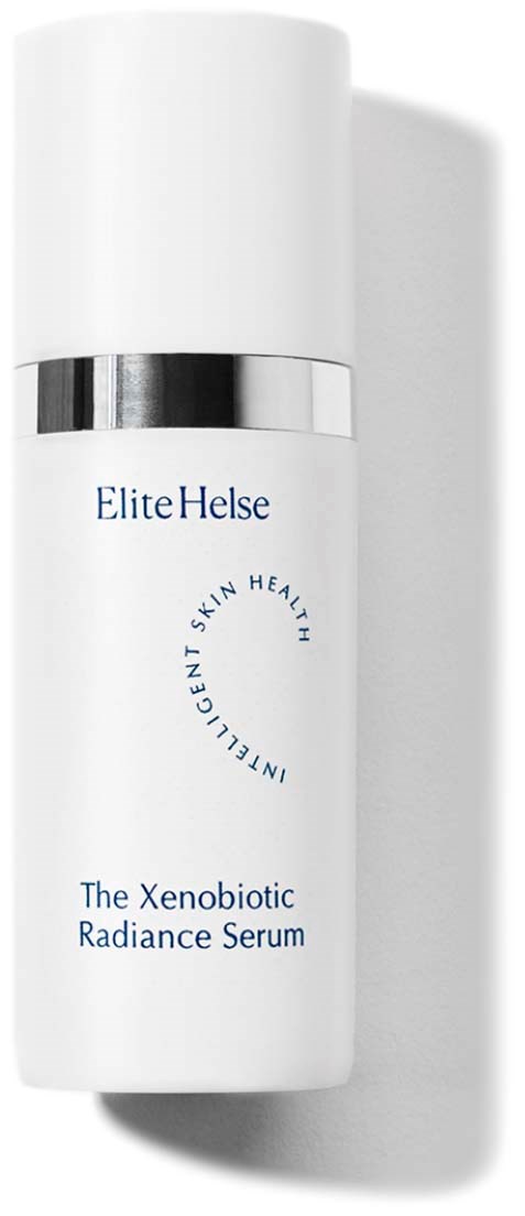 Valkoinen pullo, jossa lukee 'The Xenobiotic Radiance Serum' ja valmistaja Elite Helse, hopeinen yksityiskohta.