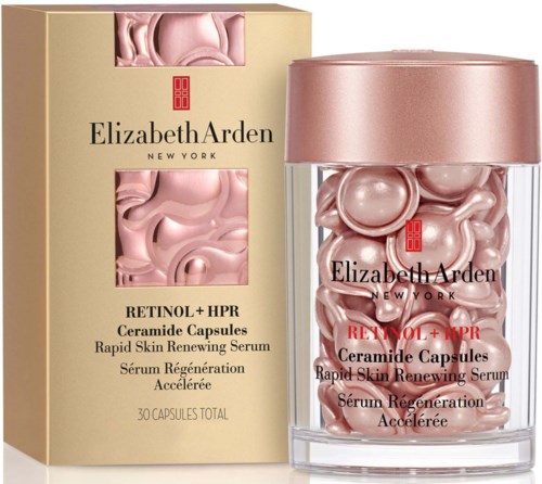 Elizabeth Arden retinolkapsler med rosa serum i en gjennomsiktig beholder og eske.