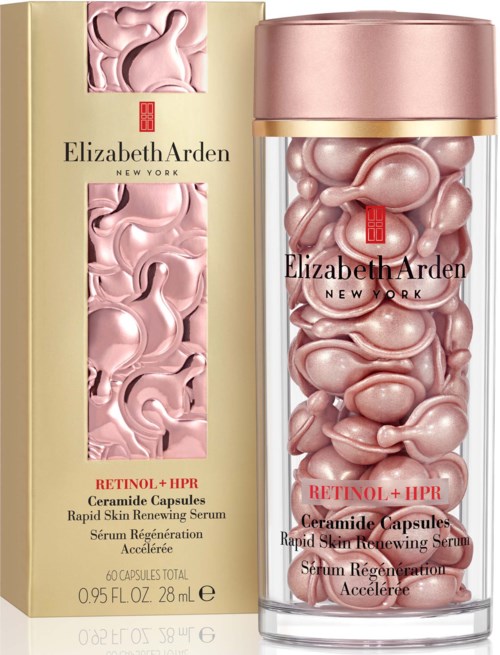 Et hudpleieprodukt med rosa, pillelignende kapsler i en klar flaske og gullfarget eske. Det er Elizabeth Arden's Retinol+HPR-serum.