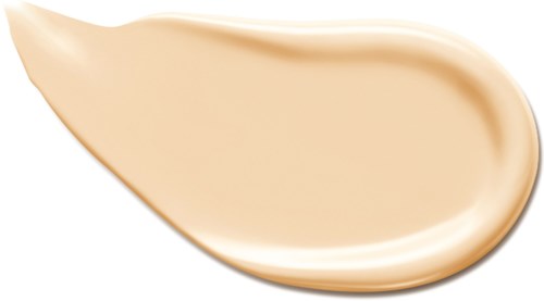 En klatt beige væske, glatt og rund, som ser ut som en krem eller foundation på huden.