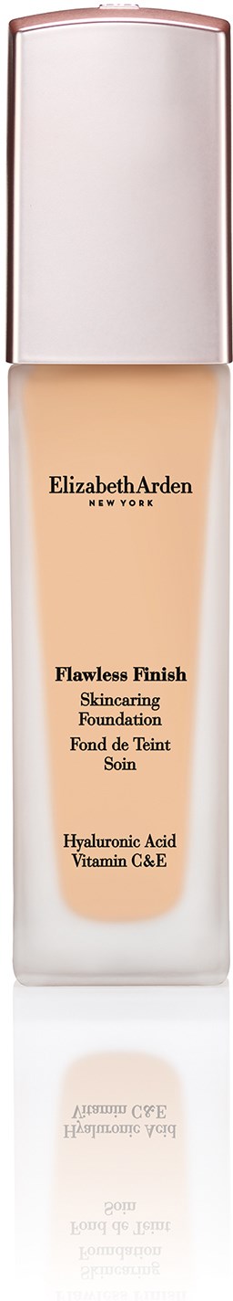 En flaske med Elizabeth Arden Flawless Finish foundation i hudfarge med sølvkork.