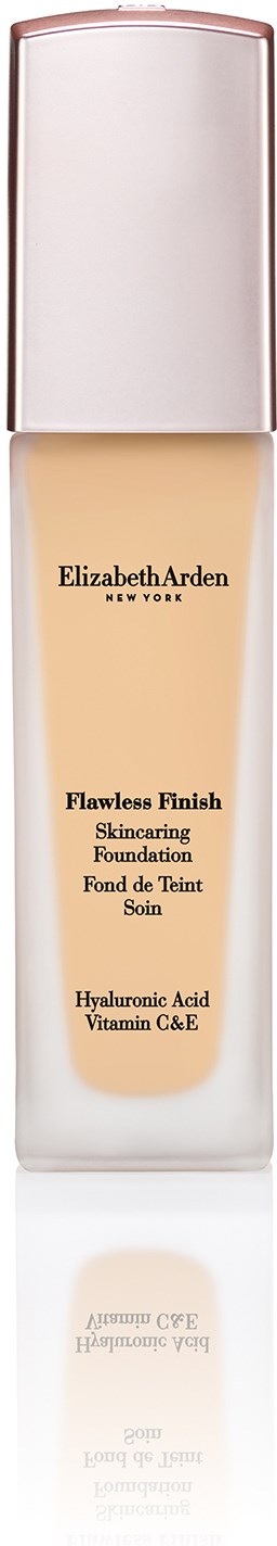 En lang, slank flaske med beige væske og sølvhette. Etiketten sier Elizabeth Arden Flawless Finish Foundation.