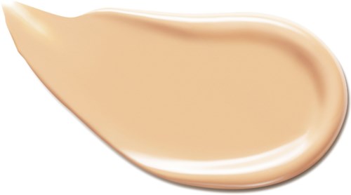 En beige farget væske eller krem med glatt tekstur, formet som en tåre eller bøyd form.